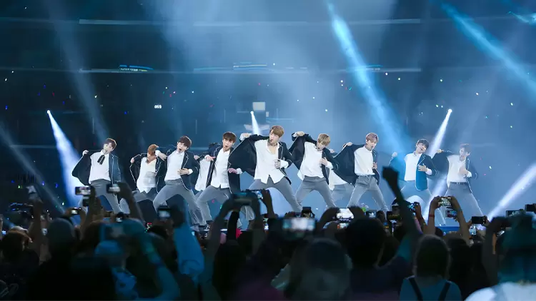 What are you typically doing at a K-Pop concert?