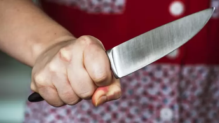 A woman is holding a knife to a man. What would she say to him?